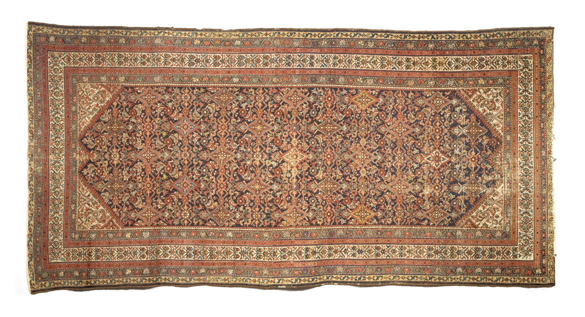 Appraisal: NORTHWEST PERSIAN LONG RUG EARLY TWENTIETH CENTURY The indigo field