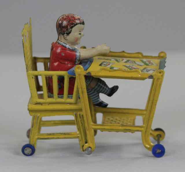 Appraisal: CHILD IN HIGH CHAIR PENNY TOY Meier Germany lithographed tin