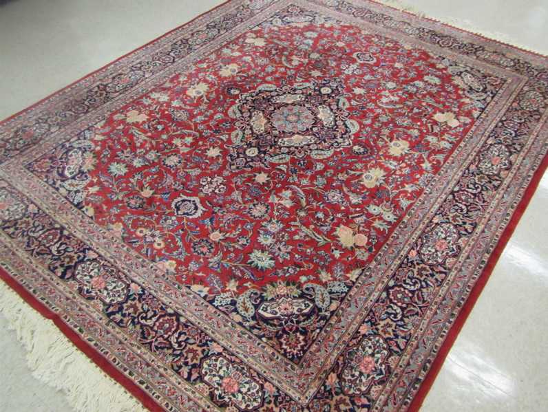 Appraisal: HAND KNOTTED ORIENTAL CARPET Indo-Persian floral and central floral medallion