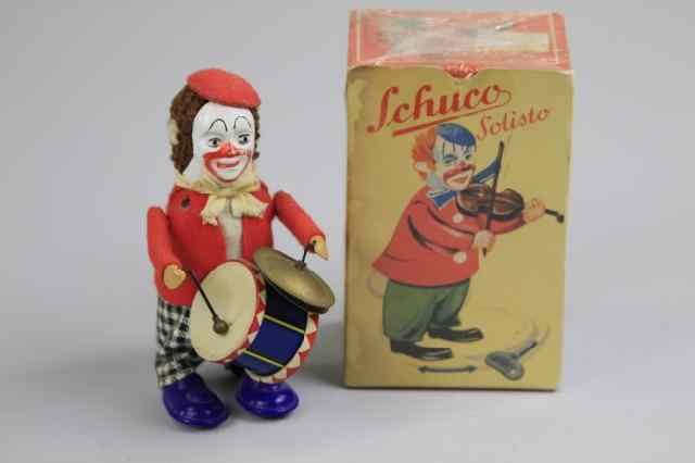 Appraisal: a CLOWN WITH DRUM Schuco Germany boxed depicted in felt