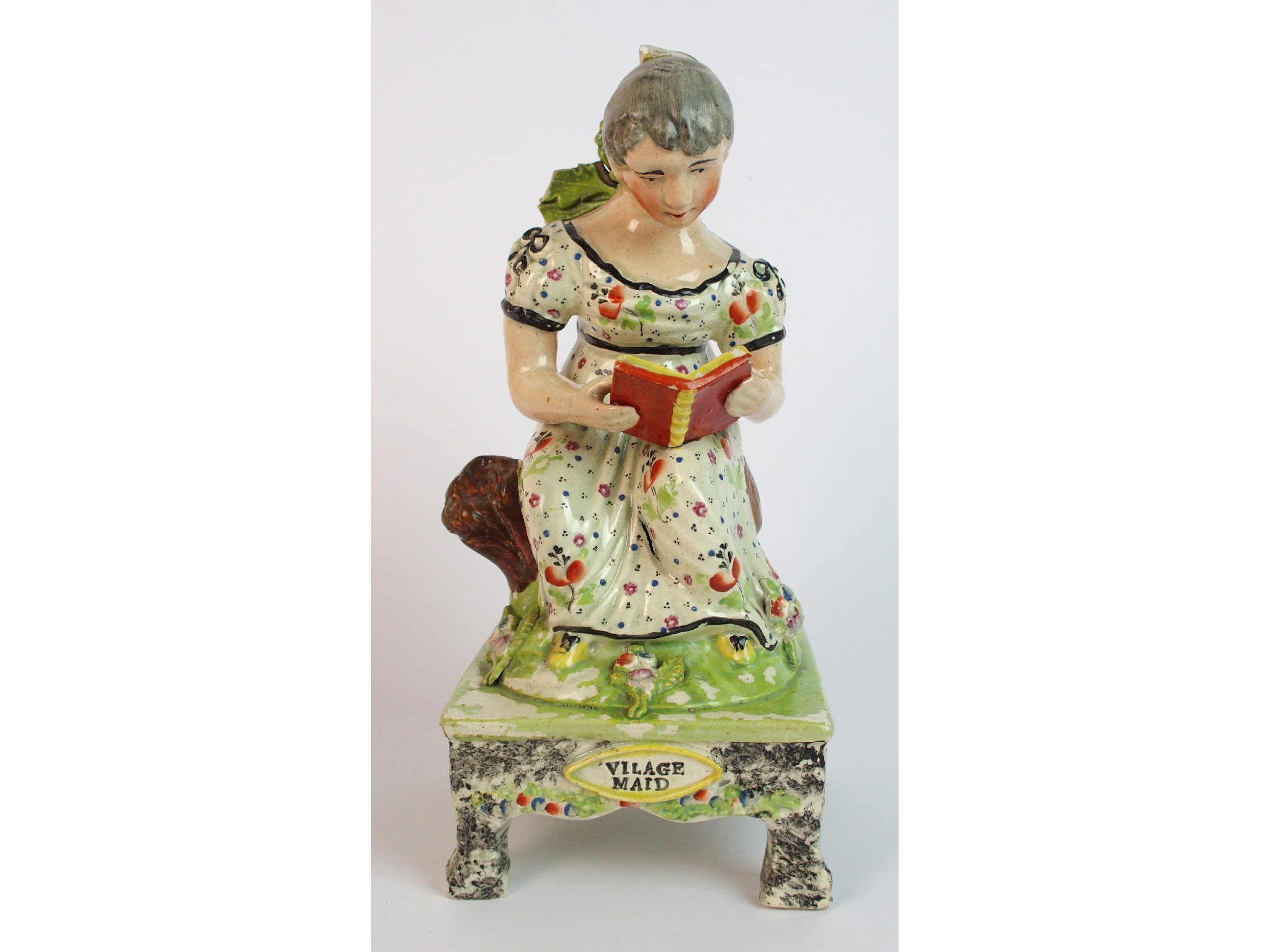 Appraisal: A th Century Staffordshire pottery figure Village Maid the female