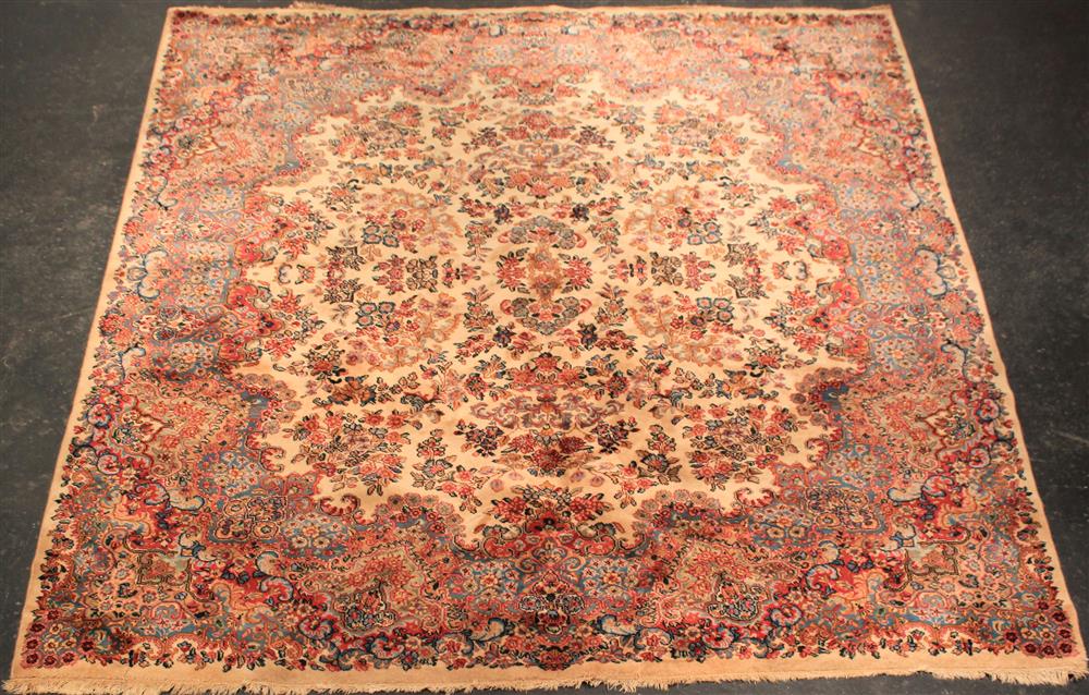 Appraisal: PERSIAN KERMAN RUG cream field with flowers and a flowering