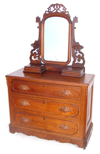 Appraisal: VICTORIAN WALNUT CHEST WITH MIRROR Pierce carved mirror frame and