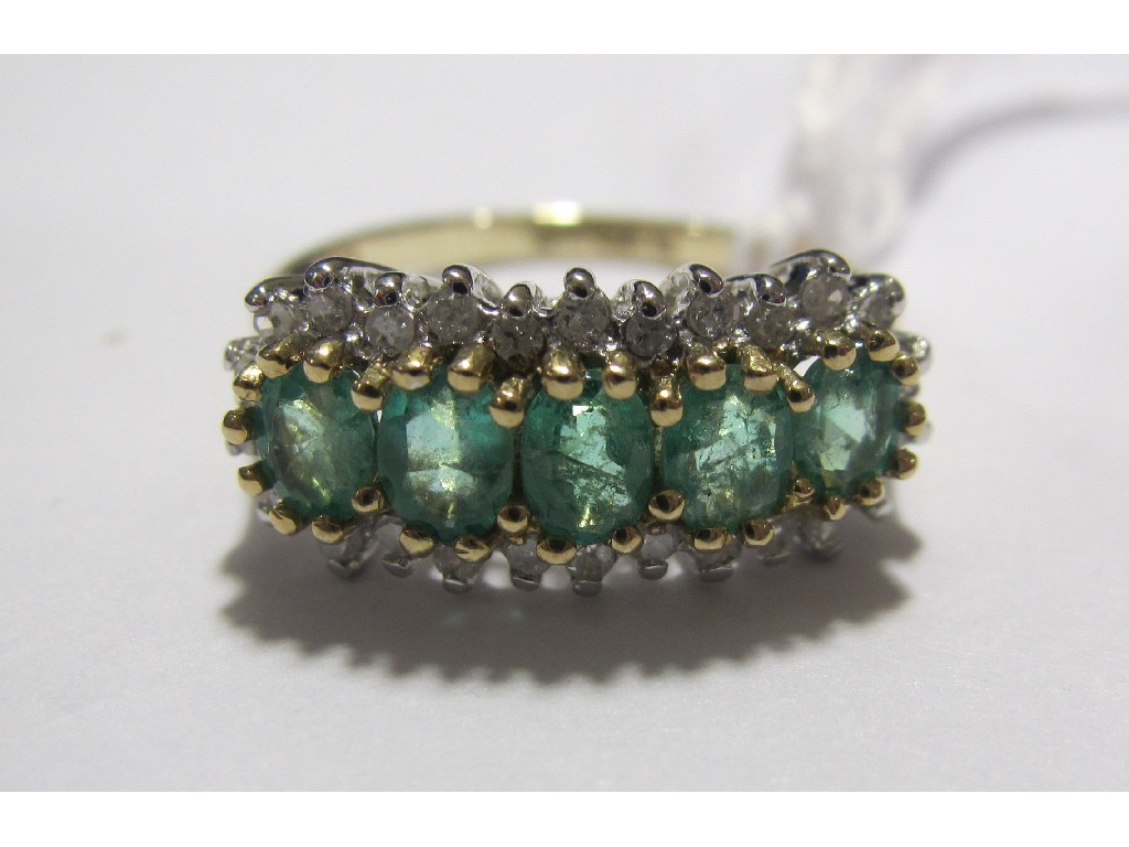 Appraisal: Nine carat gold emerald and diamond horizontal cluster ring