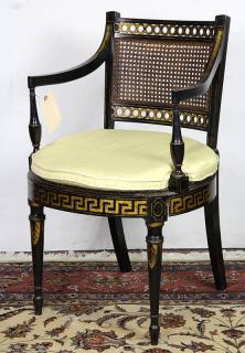 Appraisal: English ebonized and parcel gilt armchair in the Regency taste