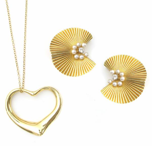 Appraisal: A gold heart pendant with chain together with a diamond