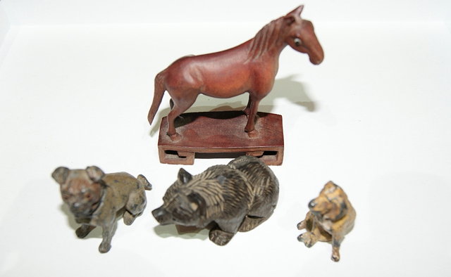 Appraisal: Two miniature cold painted figures of two dogstogether with a