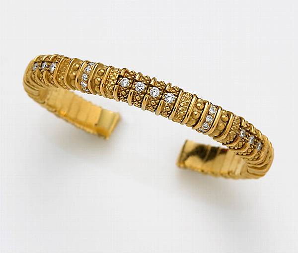 Appraisal: An eighteen karat gold and diamond bangle bracelet Judith Ripka