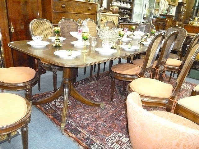 Appraisal: A GEORGE III STYLE MAHOGANY DINING TABLE with two pedestal