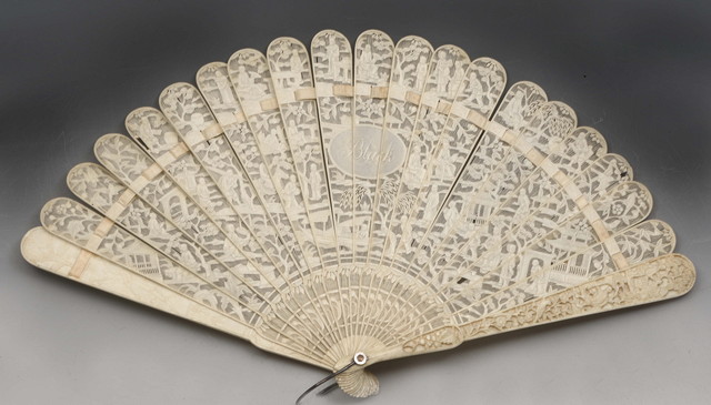 Appraisal: A CHINESE CANTON IVORY FAN with brise and carved decoration