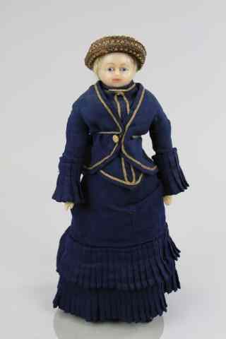 Appraisal: POURED WAX DOLL IN BLUE WALKING SUIT Poured wax shoulder