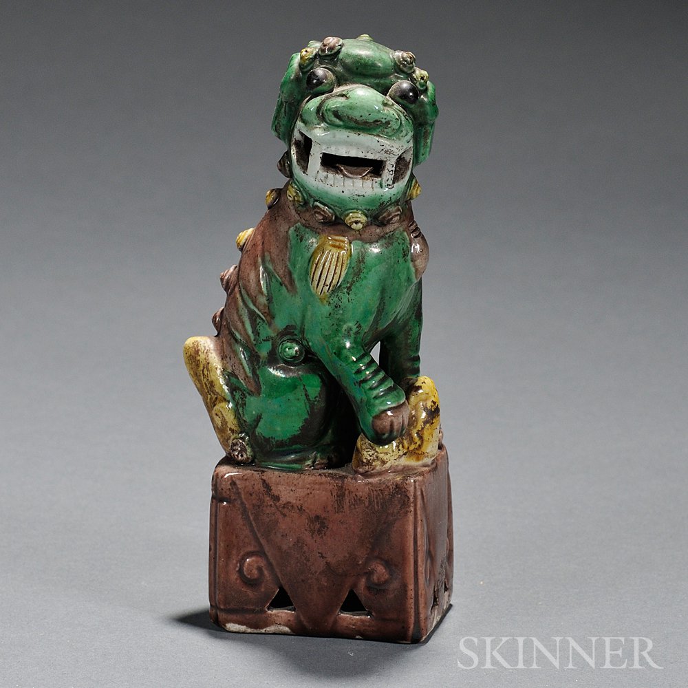 Appraisal: Sancai-style Ceramic Foo Lion China seated on a rectangular platform