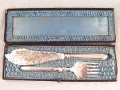 Appraisal: A pair of silver plated fish servers approx cm boxed