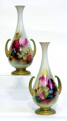 Appraisal: A PAIR OF ROYAL WORCESTER PORCELAIN VASES of bottle form