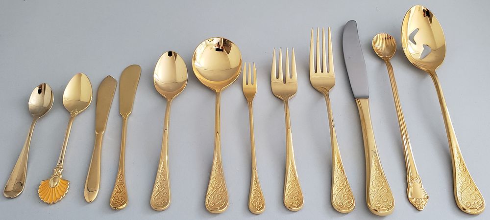 Appraisal: Piece Supreme Towle Gilt Stainless Steel Flatware Set Piece Supreme