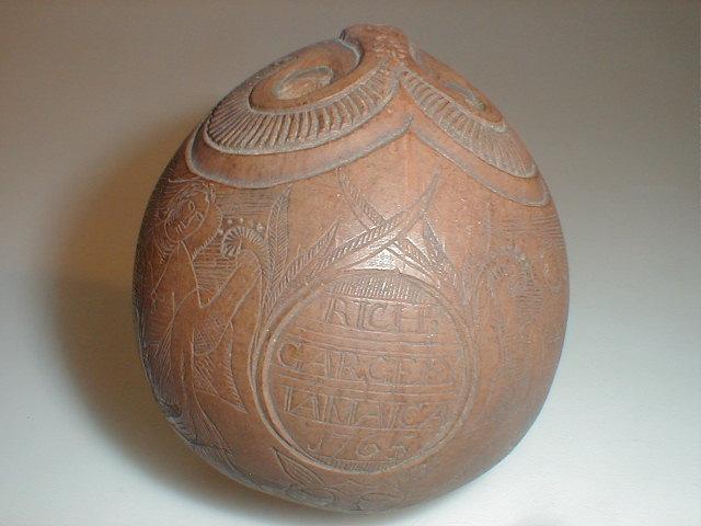 Appraisal: An thC sailor's carved coconut flask carved with a face