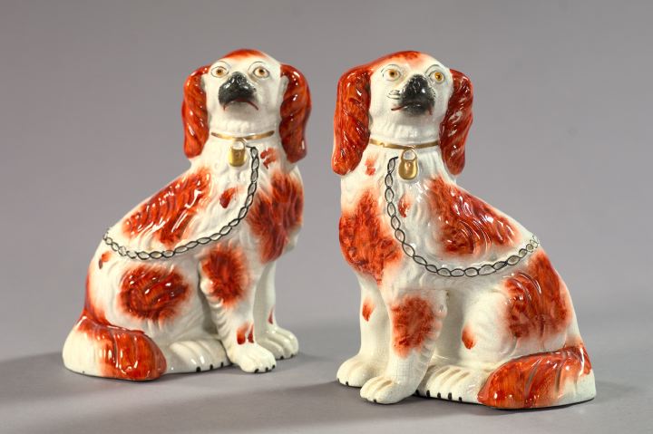 Appraisal: Pair of Staffordshire Russet-Detailed Pottery Figures of Spaniels fourth quarter