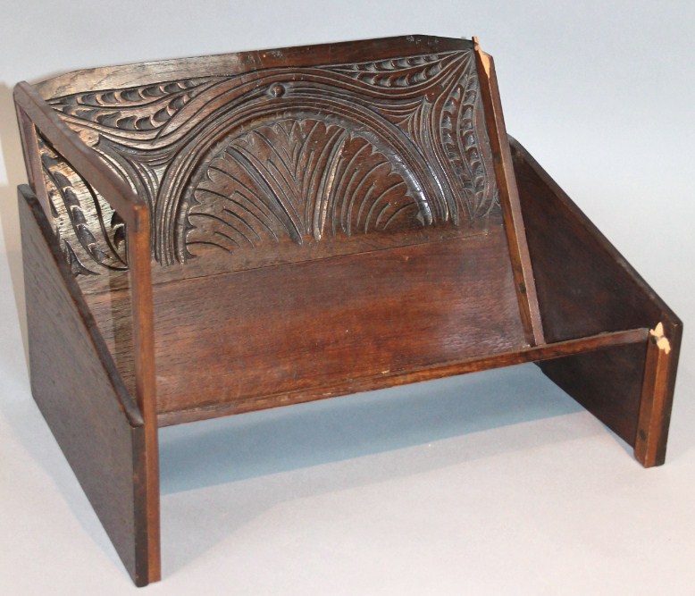 Appraisal: A thC oak Gothic style book trough with a partial