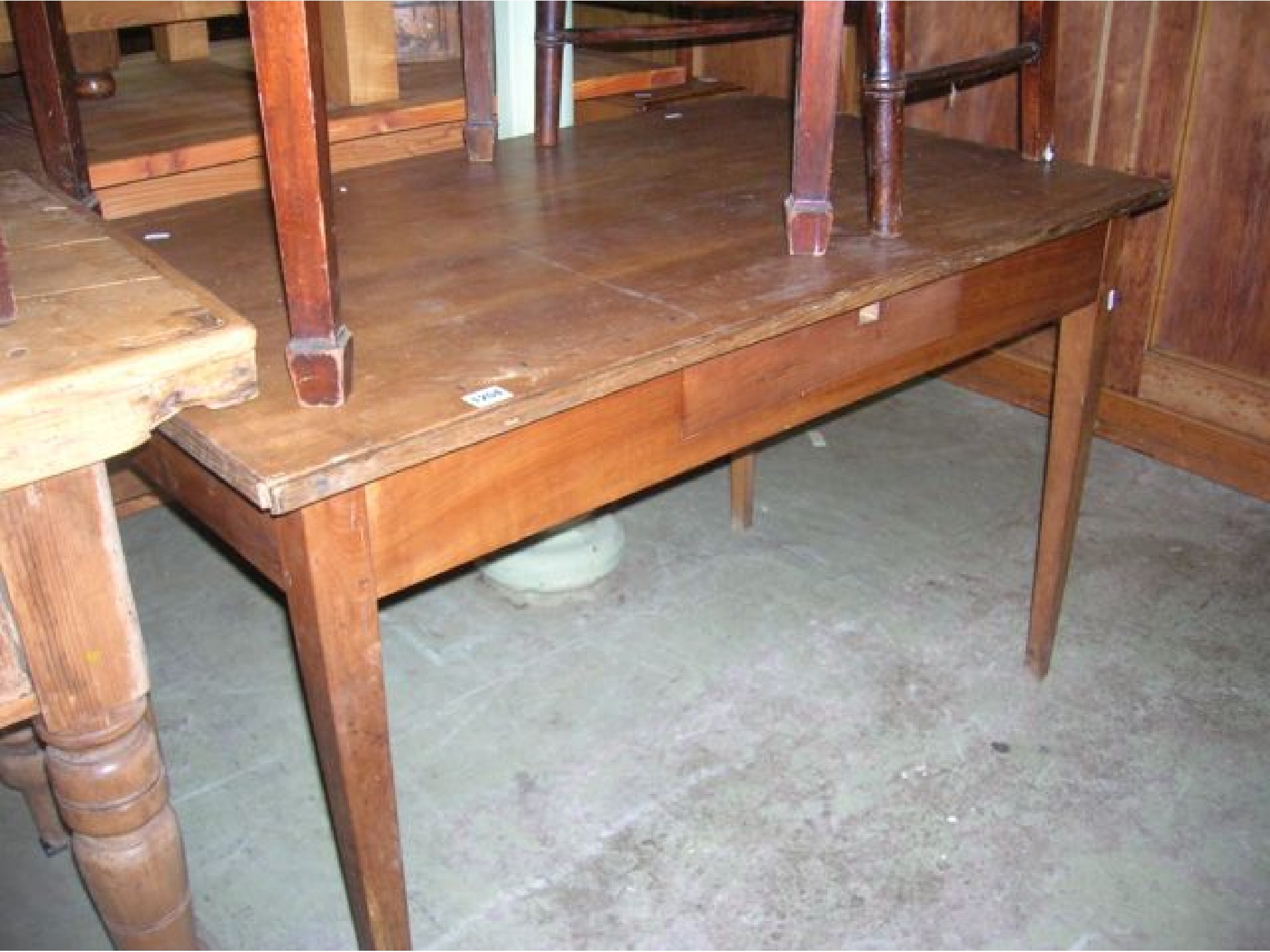 Appraisal: A th century French fruitwood kitchen table on square taper