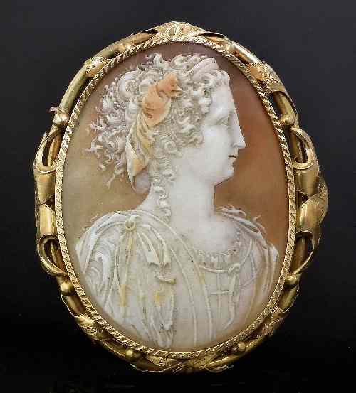 Appraisal: A Victorian gold coloured metal oval cameo brooch carved in