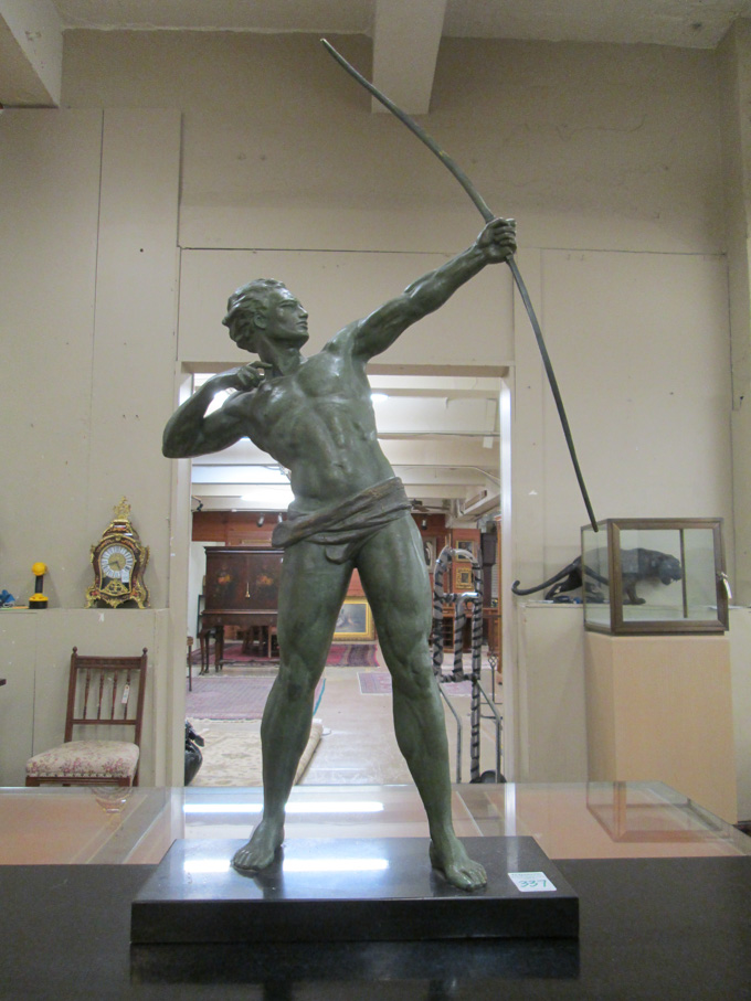 Appraisal: FIGURAL SCULPTURE a spelter male archer with bronze bow verde