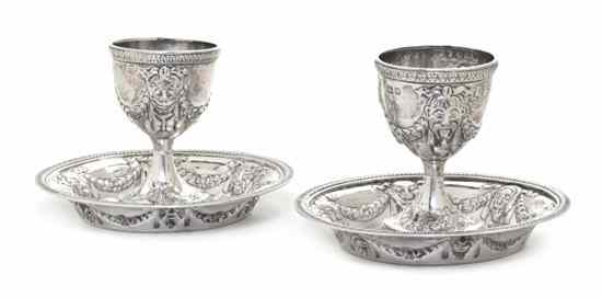 Appraisal: A Pair of English Silver Egg Cups with Underplates London