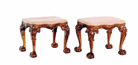 Appraisal: Pair Chippendale style mahogany footstools shaped upholstered cushion above carved