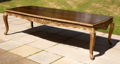 Appraisal: A George I style dining table of serpentine outline on