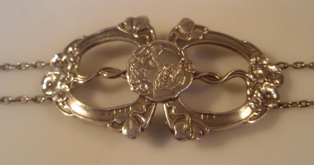 Appraisal: An Edwardian Art Nouveau silver belt with a pressed openwork