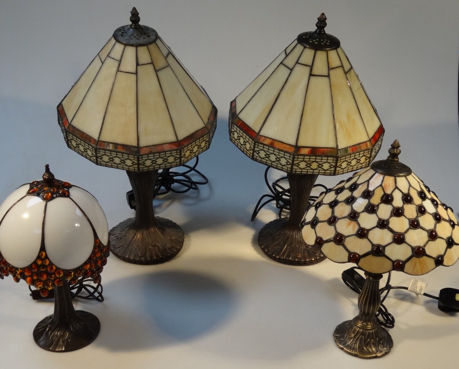 Appraisal: Four modern Tiffany style table lamps each with a leaded