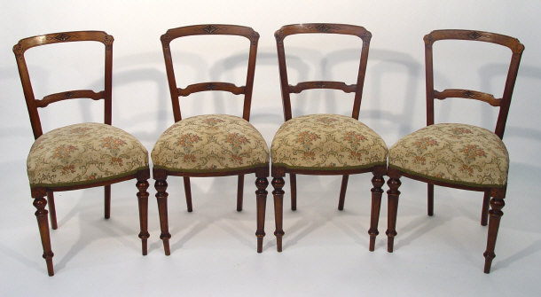 Appraisal: Set of four Victorian walnut framed dining chairs with florette