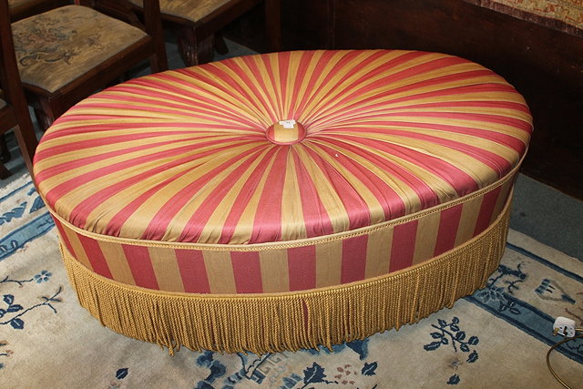 Appraisal: A STRIPED UPHOLSTERED OVAL POUFFE cm x cm