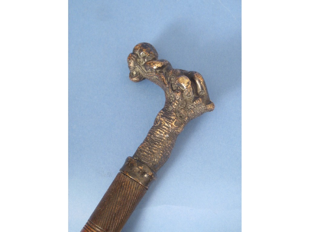 Appraisal: An old Walking Stick with cast white metal handle depicting