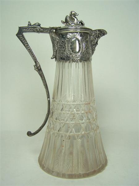 Appraisal: A silver plated claret jug the flared cut glass body