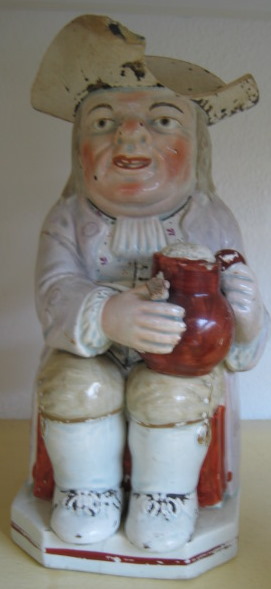 Appraisal: A Staffordshire pearlware toby jug early th century modelled seated