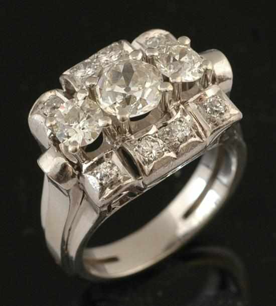 Appraisal: A diamond dress ring Comprising three principal diamonds together totalling