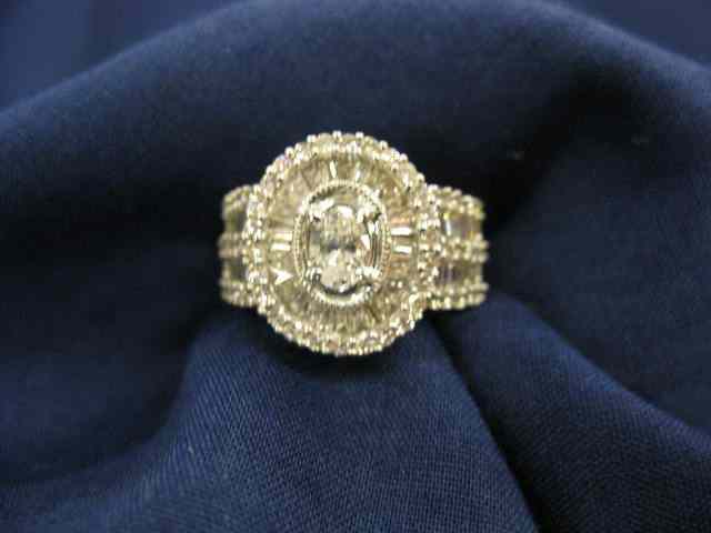 Appraisal: Diamond Ring oval center diamond surrounded by round baguette diamonds