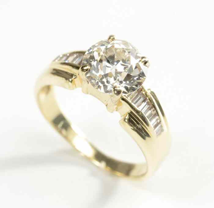 Appraisal: DIAMOND AND FOURTEEN KARAT GOLD RING featuring a round European-cut