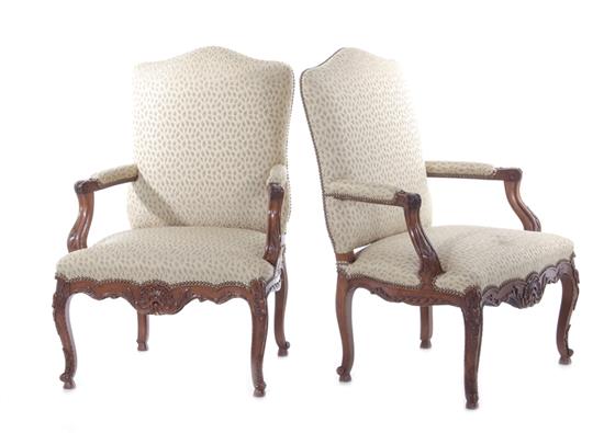 Appraisal: Pair Louis XV style carved walnut and upholstered fauteuils late