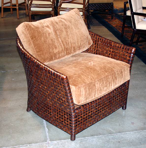 Appraisal: A pair of laced rawhide 'Antalya' lounge chairs McGuire Furniture