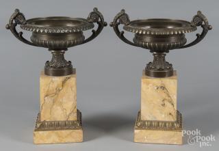 Appraisal: Pair of bronze and marble urn garnitures h Pair of