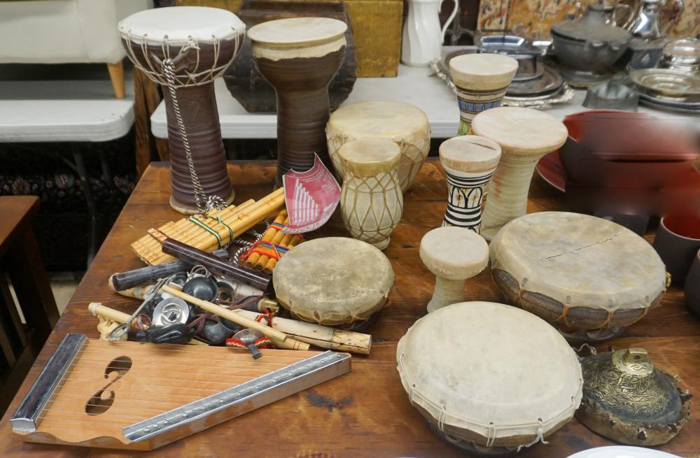 Appraisal: COLLECTION WITH HIDE BOUND DRUMS AND OTHER MUSICAL INSTRUMENTSCollection with