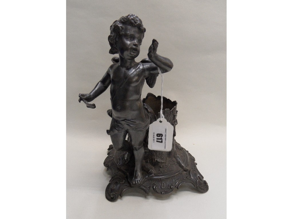 Appraisal: Pewter centrepiece modelled as a winged cherub beside a tree