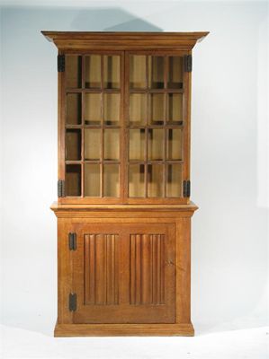 Appraisal: A limed oak bookcase designed by Charles Francis Annesley Voysey