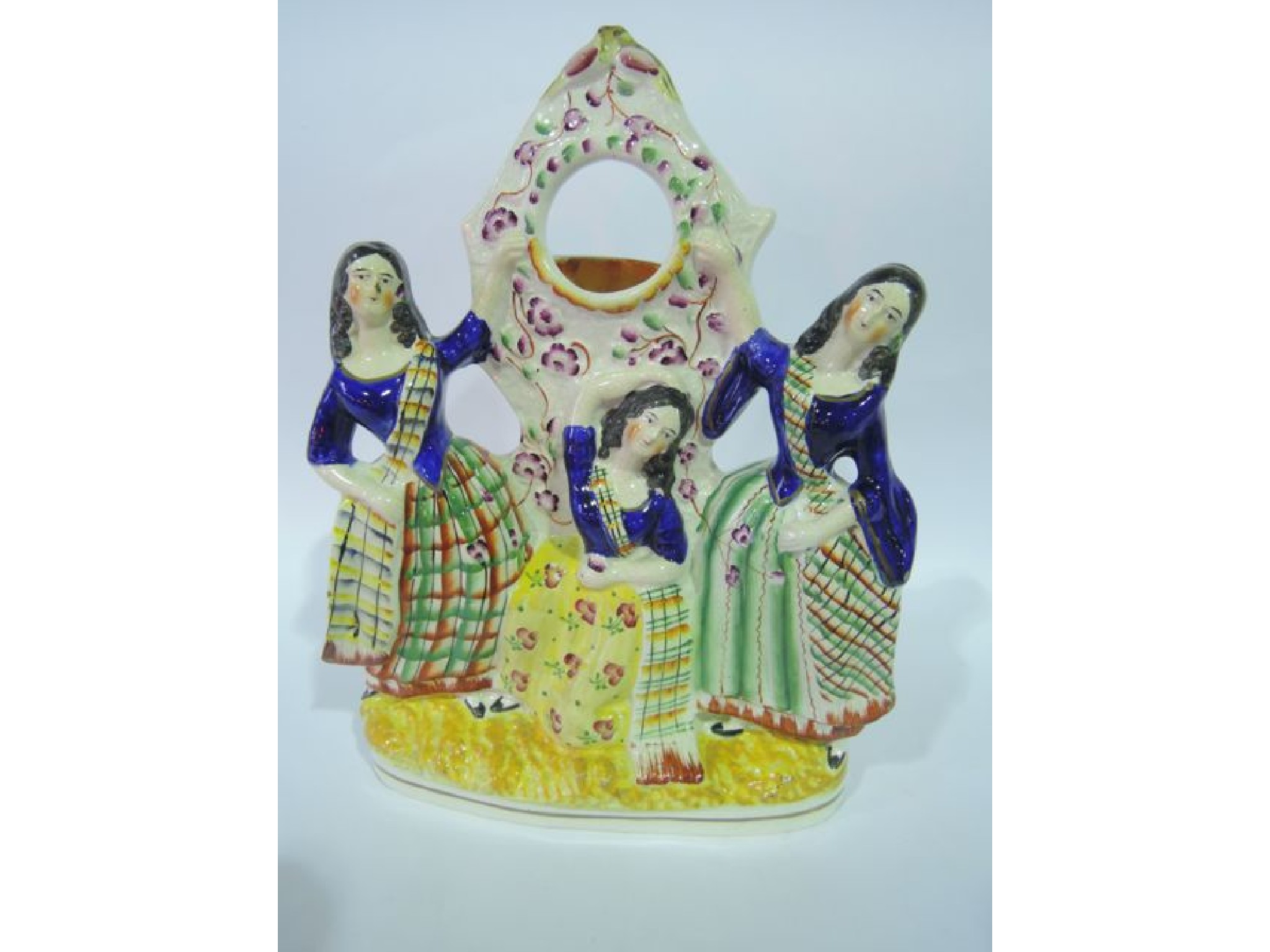 Appraisal: A th century Staffordshire watch holder with applied figures of