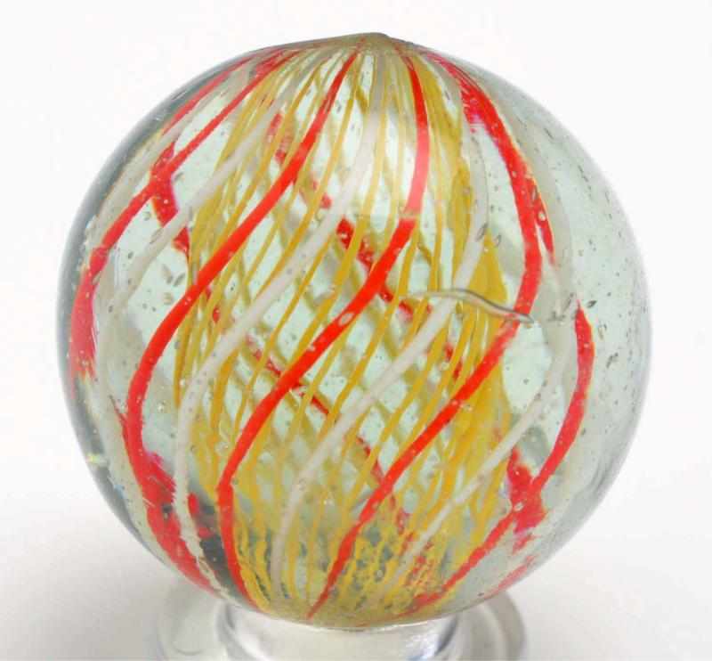 Appraisal: Yellow Latticino Swirl Marble Description Unusual alternating orange and white