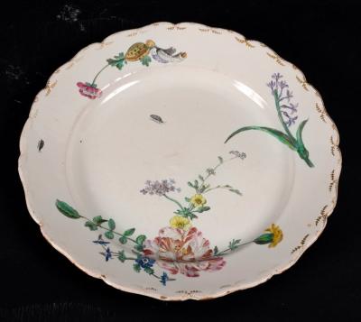 Appraisal: A Marseille faience plate Gaspard Robert's factory circa painted flowers