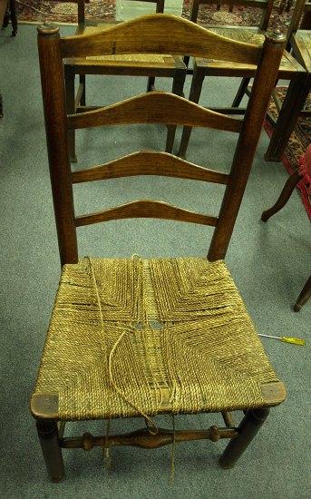 Appraisal: Two late th Century fruitwood single chairs with pierced upright