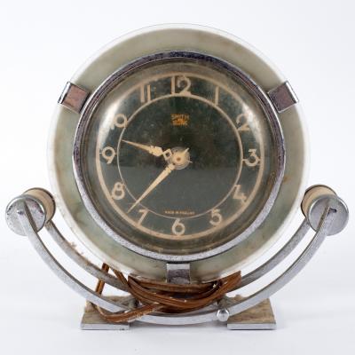 Appraisal: An Art Deco mantel clock by Smith in a chrome