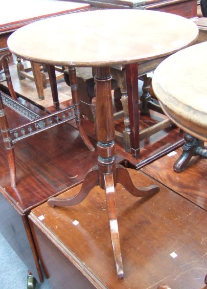 Appraisal: A Victorian mahogany tripod table the circular top raised on